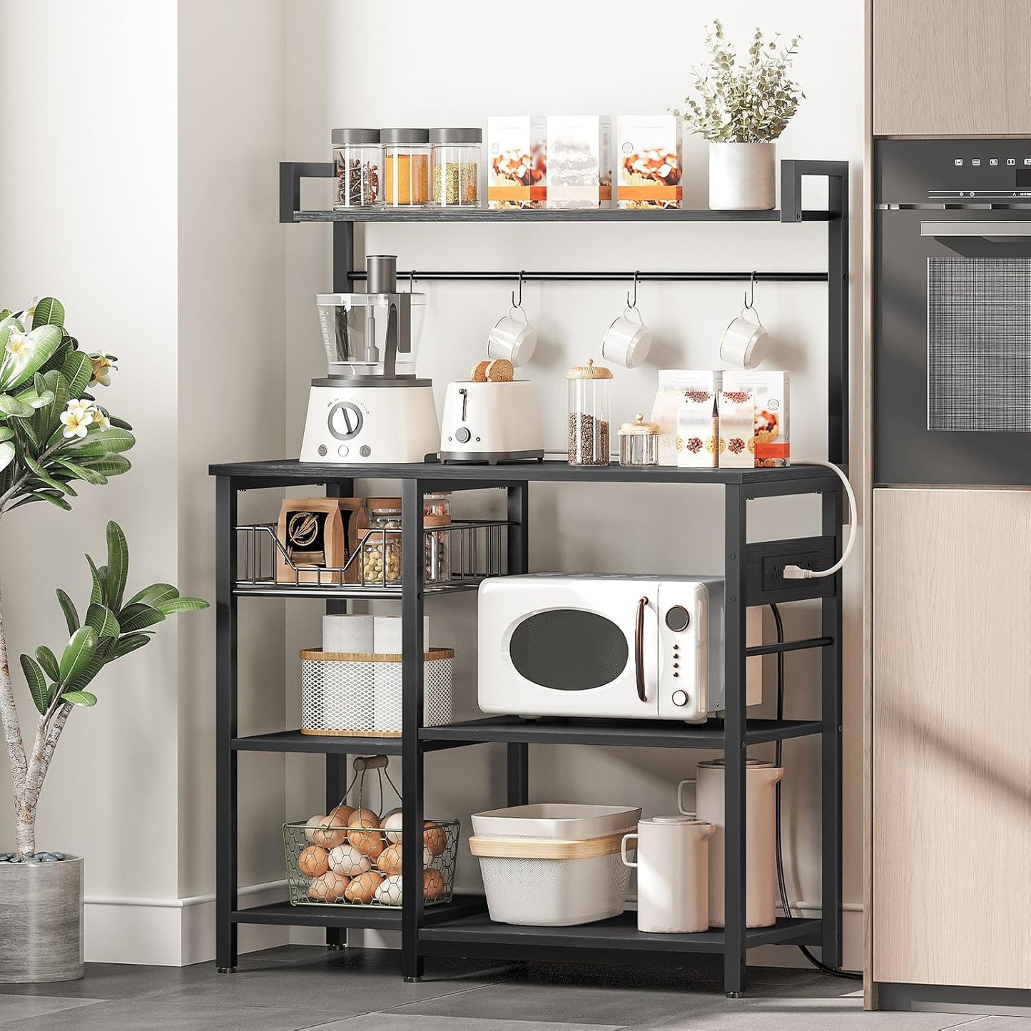 Kitchen Bakers Rack with Power Outlet, Microwave Stand, Mesh Basket, 4 Hooks, Coffee Station, Black